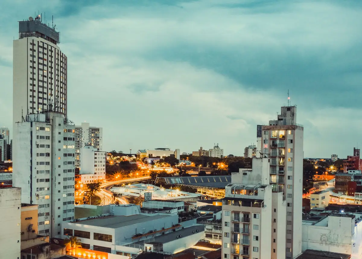 Downtown Campinas at dusk, with buildings and lit-up avenues